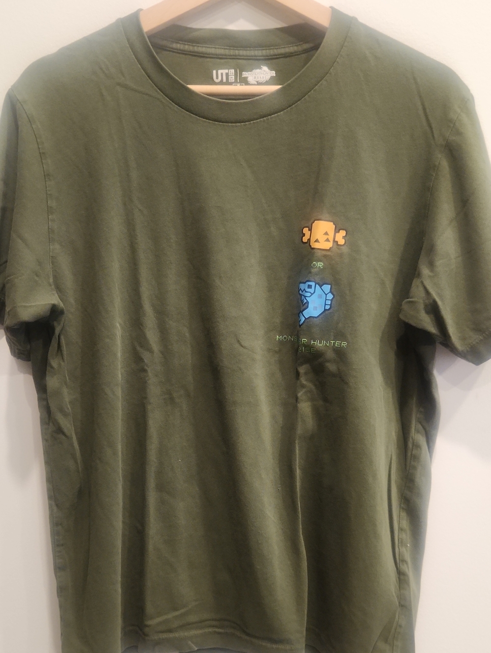 Uniqlo Olive Green Short-Sleeve Tee with Blue & Gold Monster Graphics